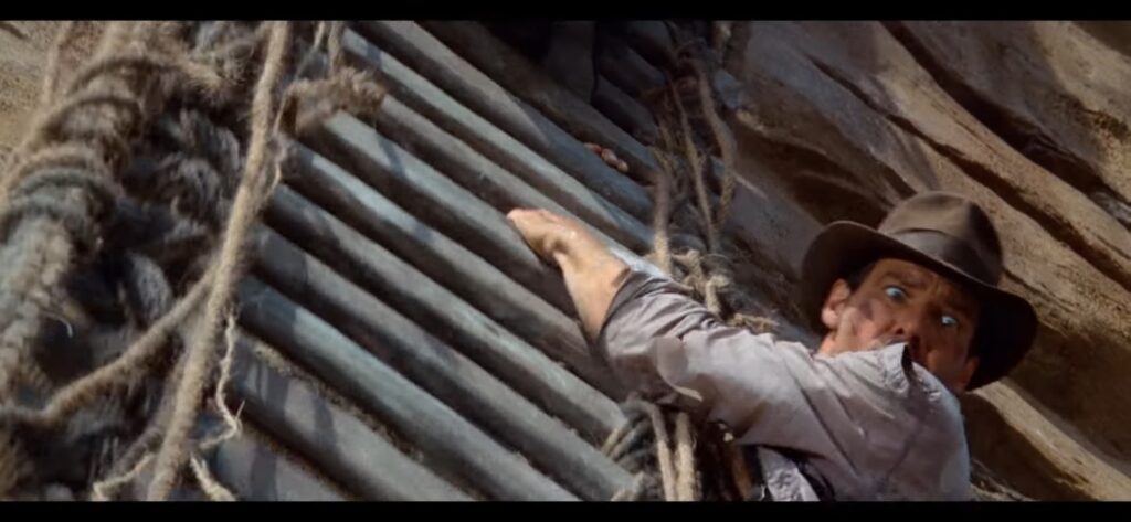 Indiana Jones (Harrison Ford) Preste a cair de uma ponte