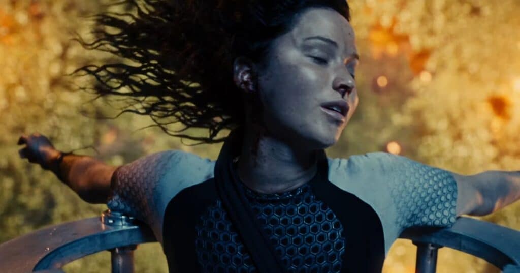 Jennifer Lawrence interpretando Katniss Everdeen em Jogos Vorazes: Em Chamas