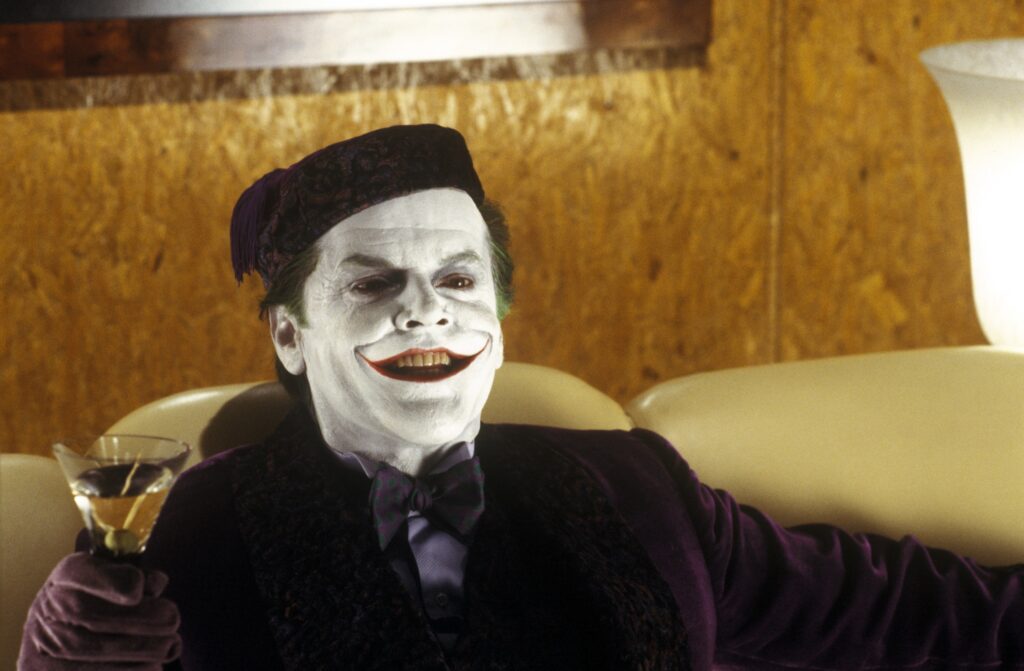 Jack Nicholson como Coringa em Batman (1989). Distribuição: Warner Bros. Pictures.